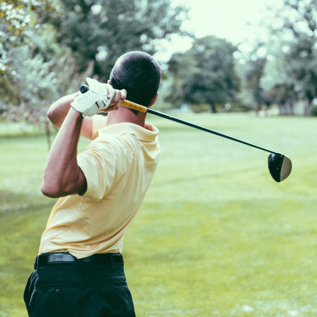 a golfer swinging a golf club